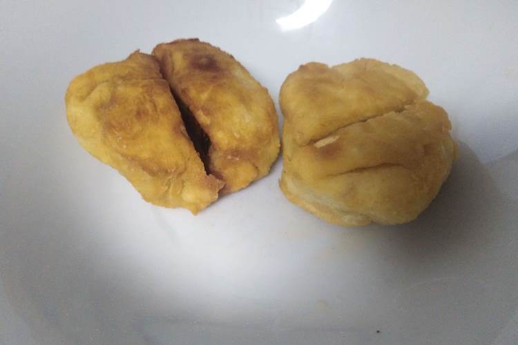 Two balls of crust, each cut in half (innards not visible)